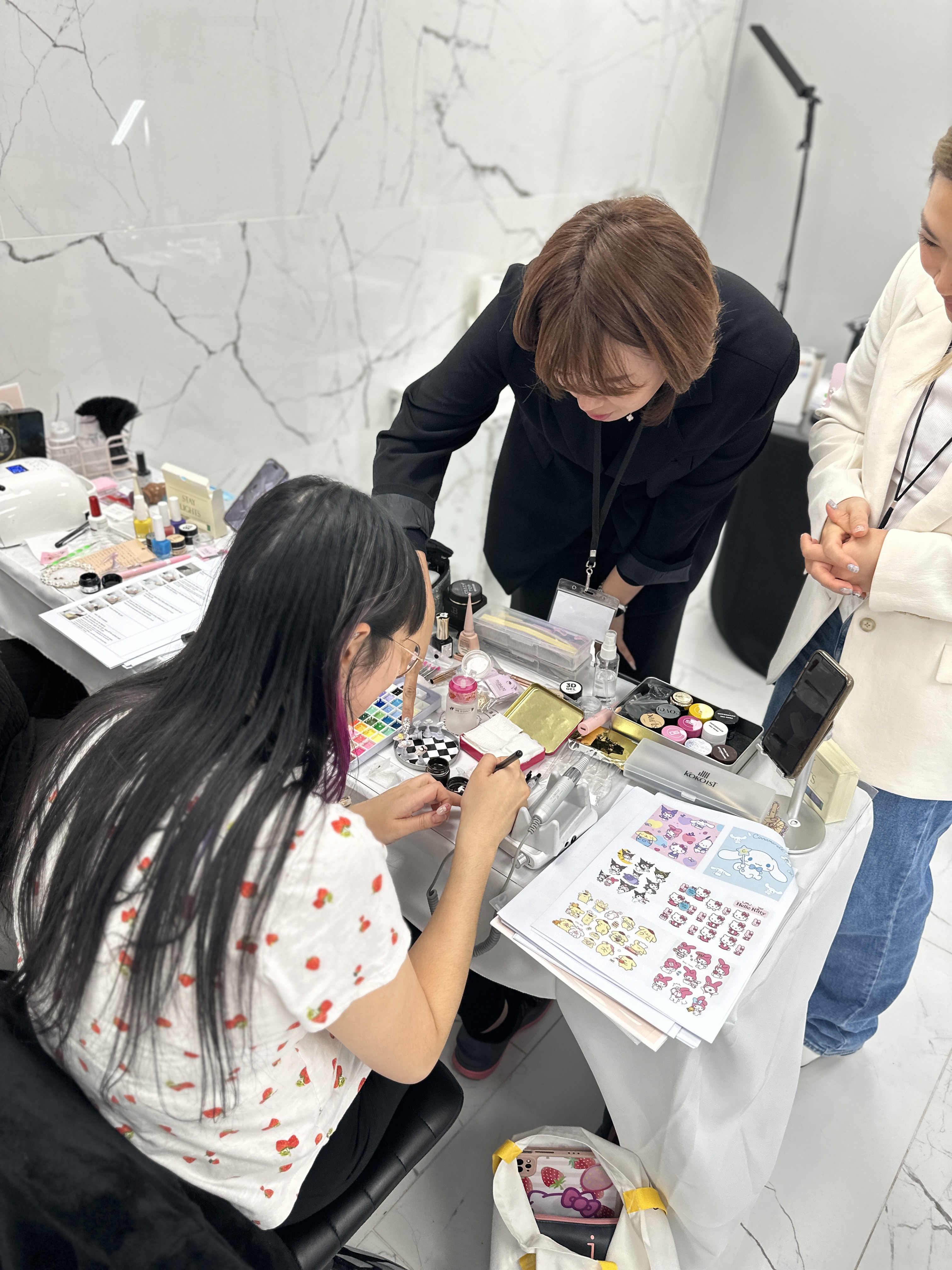 Students practicing Korean nail art techniques during the Make.N seminar