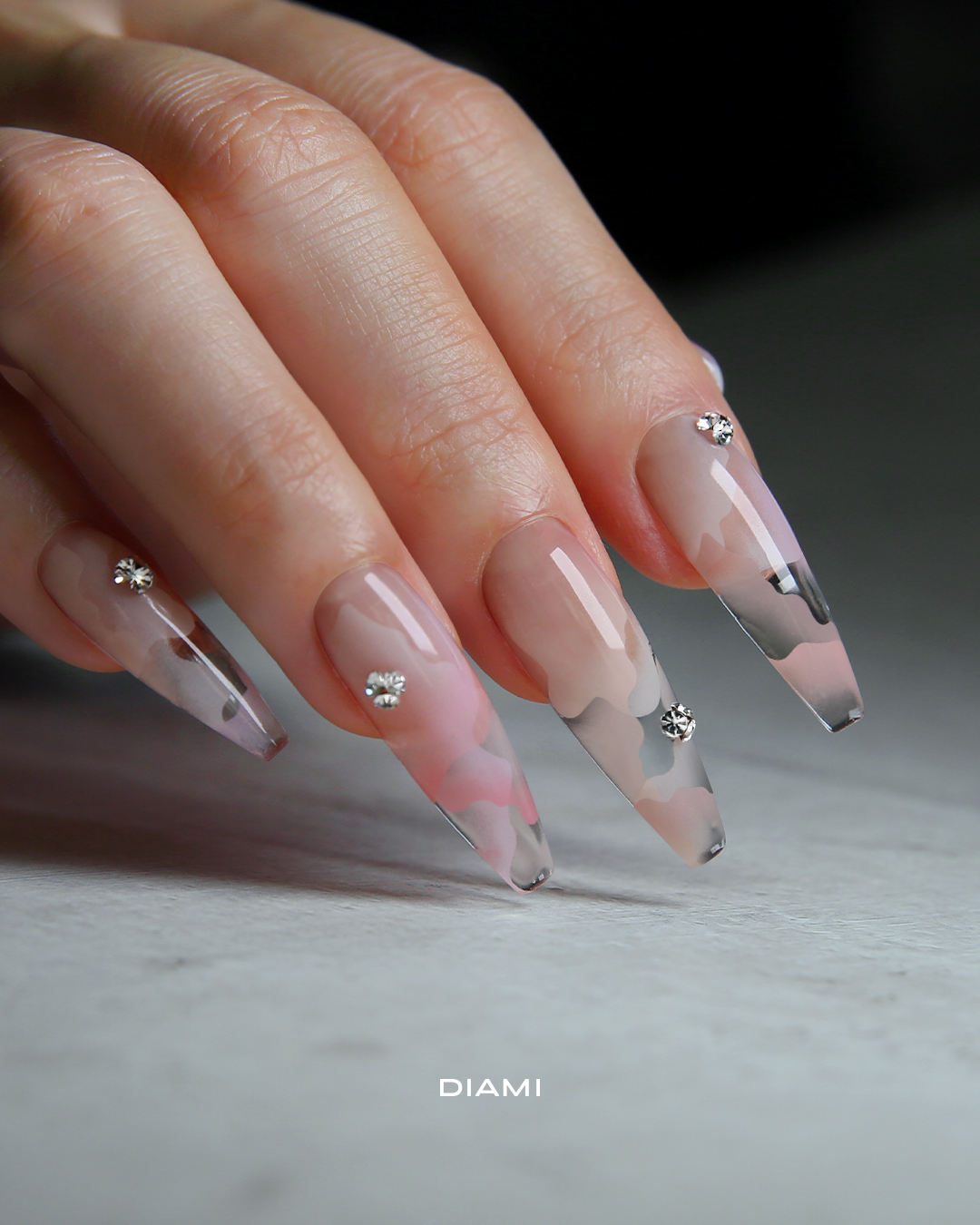 Delicate DIAMI stencil nail art example